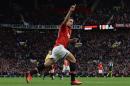 Manchester United's Van Persie celebrates scoring against Stoke City during English Premier League soccer match at Old Trafford Stadium in Manchester