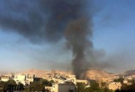 Smoke rises from the site of an explosion in Damascus. Twin blasts near army headquarters rocked the Syrian capital after Qatar called for an Arab intervention against Bashar al-Assad's regime and a no-fly zone to protect refugees