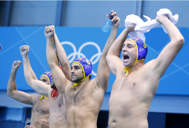 Spain&#39;s team players celebrate winning during their men&#39;s preliminary round Group A water polo match against Greece at London 2012 Olympic Games at Water Polo Arena