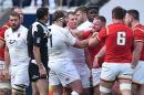 England's prop Joe Marler (C) clashes with Wales' prop Samson Lee (3rd R) during the Six Nations international rugby union match on March 12, 2016