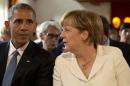 German Chancellor Angela Merkel, right, speaks with U.S. President Barack Obama during a concert at the G-7 summit at Schloss Elmau hotel near Garmisch-Partenkirchen, southern Germany, Sunday, June 7, 2015. The two-day summit will address such issues as climate change, poverty and the situation in Ukraine. (AP Photo/Virginia Mayo, Pool)