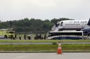 A plane from Ireland makes an emergency landing because of an unspecified threat, Wednesday, Aug. 7, 2013, in Philadelphia. (AP Photo/Matt Rourke)