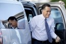 Republican presidential candidate, former Massachusetts Gov. Mitt Romney exits his vehicle before boarding his campaign plane in West Palm Beach, Fla, Tuesday, Oct. 23, 2012, enroute to Nevada for a campaign stop, after yesterday's final presidential debate with President Barack Obama. (AP Photo/David Goldman)