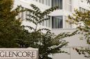 FILE PHOTO - The logo of commodities trader Glencore is pictured in front of the company's headquarters in Baar