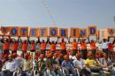 Supporters of Narendra Modi, the prime ministerial candidate for Bharatiya Janata Party, hold placards during a rally in Ahmedabad