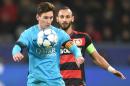 Leverkusen's Omer Toprak, right, and Barcelona's Lionel Messi challenge for the ball during the Champions League Group E soccer match between Bayer Leverkusen and FC Barcelona in Leverkusen, western Germany, Wednesday, Dec. 9, 2015. (AP Photo/Sebastian Konopka)