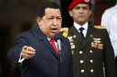 Hugo Chavez talks to the media during the welcoming ceremony of Alexander Lukashenko at Miraflores Palace in Caracas