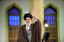 Iran's Supreme Leader Ayatollah Ali Khamenei waves as he arrives to address workers in Tehran