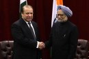 Pakistan's PM Sharif shakes hands with India's PM Singh during the United Nations General Assembly in New York