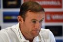 England's Wayne Rooney attends a press conference at the St George's Park training complex, near Burton-upon-Trent, central England on October 8, 2013