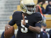 FILE - In this April 16, 2011, file photo, Notre Dame quarterback Everett Golson sprints out of the pocket during the first half of a spring NCAA college football game in South Bend, Ind. A Notre Dame spokesman says Golson is no longer enrolled at the school. (AP Photo/Joe Raymond, File)