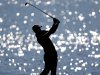 Luke Donald, of England, hits off the fairway on the 17th hole during the final round of the Tour Championship golf tournament, Sunday, Sept. 23, 2012, in Atlanta. (AP Photo/David Goldman)