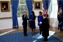 U.S. President Barack Obama is sworn in by U.S. Supreme Court Chief Justice John Roberts in the Blue Room of the White House in Washington,