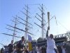 British around-the-world sailor Knox-Johnson carries the Olympic Torch around the restored Cutty Sark boat at Greenwich in London