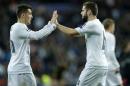 Real Madrid's Nacho Fernandez, right, the scorer of the game is congratulated by his teammate Mateo Kovacic after the Champions League group A soccer match between Real Madrid and PSG at the Santiago Bernabeu stadium in Madrid, Tuesday, Nov. 3, 2015. Real Madrid won 1-0. (AP Photo/Francisco Seco)