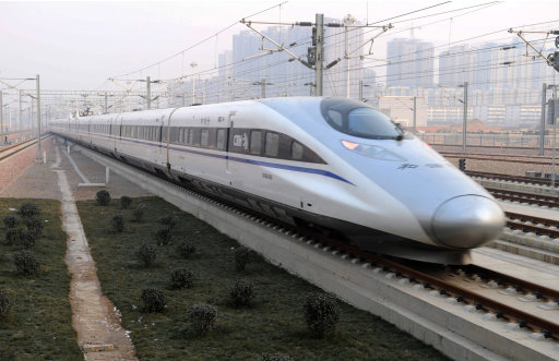 In this photo released by China's Xinhua news agency, a high-speed train G802 leaves for Beijing from Shijiazhuang, capital of north China's Hebei Province, Wednesday, Dec. 26, 2012. China has opened the world's longest high-speed rail line, which runs 2,298 kilometers (1,428 miles) from the country's capital in the north to Guangzhou, an economic hub in the Pearl River delta in southern China. (AP Photo/Xinhua, Wang Xiao) NO SALES