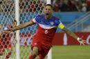 United States' Clint Dempsey celebrates after scoring the opening goal during the group G World Cup soccer match between Ghana and the United States at the Arena das Dunas in Natal, Brazil, Monday, June 16, 2014. (AP Photo/Ricardo Mazalan)