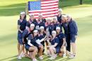 Team United States celebrate with the trophy after beating Europe in the Golf Solheim Cup in St.Leon-Rot, Germany, Sunday, Sept. 20, 2015. U.S. Paula Creamer defeated Germany's Sandra Gal to complete a remarkable comeback as United States won the Solheim Cup with a 14½-13½ victory over Europe on Sunday. Creamer made five birdies in 15 holes to win the final singles match 4 and 3 and give the U.S. its first title since 2009. ( AP Photo/Michael Probst)