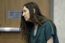 Megan Huntsman, accused of killing six of her babies and storing their bodies in her garage, appears in court Monday, April 28, 2014, in Provo, Utah. Prosecutors have filed six first-degree murder charges against Huntsman. (AP Photo/Rick Bowmer, Pool)