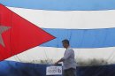 an walks past Cuban flag on his way from campaign stop Vice Presidential nominee Ryan made at Cuban restaurant and coffee shop, Versailles, in Miami