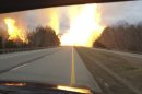 This image provided by the Kanawha County Emergency Services shows flames erupting across Interstate 77 from a gas line explosion in Sissonville, W. Va., Tuesday Dec. 11, 2012. At least five homes went up in flames Tuesday afternoon and a badly damaged section of Interstate 77 was shut down in both directions near Sissonville after a major gas line explosion triggered an hour-long inferno that officials say spanned about a quarter-mile. (AP Photo/Kanawha County Emergency Services)