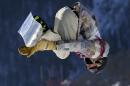 United States' Sage Kotsenburg takes a jump during the men's snowboard slopestyle semifinal at the Rosa Khutor Extreme Park, at the 2014 Winter Olympics, Saturday, Feb. 8, 2014, in Krasnaya Polyana, Russia. (AP Photo/Sergei Grits)