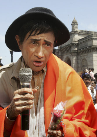 FILE - In this Monday, Sept. 26, 2005 file photo, Bollywood actor Dev Anand speaks during the filming of his movie "Mr. Prime Minister" in Bombay, India. According to media reports, Anand has died of a heart attack in a London hospital Saturday, Dec. 3, 2011. He was 88. (AP Photo/Rajesh Nirgude, File)