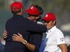 U.S. captain Love III congratulates Watson and Simpson after they defeated Team Europe golfers Hanson and Lawrie on the 14th green during the afternoon four-ball round at the 39th Ryder Cup matches at the Medinah Country Club