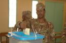 A member of the military casts his ballot in the second round of legislative and municipal elections in Nouakchott on December 20, 2013