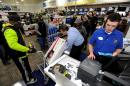 FILE - In this Nov. 29, 2013, file photo, Best Buy employee Christopher Gervais, right, rings up a 32-inch LED TV in Dunwoody, Ga. Sales at U.S. stores dropped 3.1 percent to $42.7 billion for the week that ended on Sunday, Dec. 22, 2013, compared with the same week last year, according to ShopperTrak, which tracks data at 40,000 locations. (AP Photo/David Tulis, File)