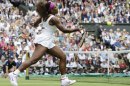 Serena Williams of the United States plays a shot against Agnieszka Radwanska of Poland during the women's final match at the All England Lawn Tennis Championships at Wimbledon, England, Saturday, July 7, 2012. (AP Photo/Alastair Grant)