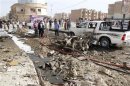 Iraqi security personnel are seen at the site of a bomb attack in Kirkuk