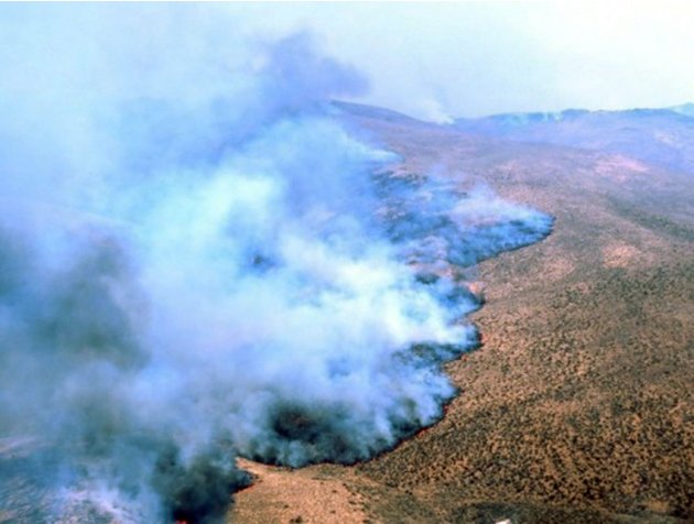 This Aug. 11, 2012 photo provided by the U.S. Bureau of Land Management shows the Holloway Fire outside Denio, Nev., which has burned more than 525 square miles of remote rangeland straddling the Oreg