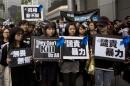 Staff members of Ming Pao newspaper take part in the march against violence on journalists in Hong Kong