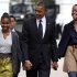 President Barack Obama walks to St. John's Episcopal Church from the White House with his daughters Sasha, left, and Malia, in Washington, on Sunday, Oct. 28, 2012.  (AP Photo/Jacquelyn Martin)