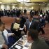 Job seekers speak with with job recruiters while they attend the Coast to Coast job fair in New York