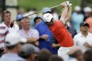 Rory McIlroy, of Northern Ireland, tees off on the 15th hole during the first round of the Memorial golf tournament Thursday, May 29, 2014, in Dublin, Ohio. (AP Photo/Darron Cummings)