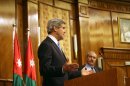 U.S. Secretary of State John Kerry, left, speaks during a joint news conference with his Jordanian counterpart, Nasser Judeh, right, in Amman Wednesday, May 22, 2013. Secretary of State John Kerry says the United States and its Arab and European allies will step up their support for Syria's opposition to help them 