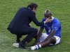 Italy's coach Prandelli comforts Balotelli after the game against Spain at the Euro 2012 final soccer match at the Olympic Stadium in Kiev