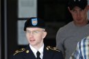 Army Pfc. Bradley Manning is escorted out of a courthouse in Fort Meade, Md., Tuesday, June 25, 2013, after the start of the fourth week of his court martial. Manning is charged with indirectly aiding the enemy by sending troves of classified material to WikiLeaks. He faces up to life in prison if convicted. (AP Photo/Jose Luis Magana)