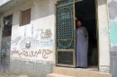 Sayed Mursi, 50, brother of ousted Egyptian president Mohamed Mursi, stands at the entrance to his house in the village of al-Adwa, in the Nile Delta province of Sharqiya