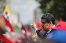 Handout picture released by the Venezuelan Presidency showing Venezuelan President Nicolas Maduro delivering a speech to supporters during a gathering in Caracas on October 26, 2016
