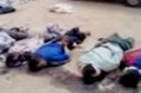 In this image made from amateur video released by the Shaam News Network and accessed Tuesday, May 29, 2012, purports to show 13 blindfolded and handcuffed bodies on the ground in Deir el-Zour, Syria. U.N. observers have discovered 13 bound corpses in eastern Syria, many of them apparently shot execution-style, the monitoring mission said Wednesday. (AP Photo/Shaam News Network via AP video) TV OUT, THE ASSOCIATED PRESS CANNOT INDEPENDENTLY VERIFY THE CONTENT, DATE, LOCATION OR AUTHENTICITY OF THIS MATERIAL