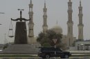 In this picture dated Thursday, May 3, 2012, A justice symbol monument is seen in front of a mosque in Ras al Khaimah, United Arab Emirates. At least eight people _ including a member of Ras al-Khaimah's ruling family _ have been detained this year for suspected links to the group al-Islah, or Reform. Five others have been reported missing by rights groups that claim undercover security agents took them into custody. Members of the Islamist group describe their goals in purely populist terms, saying they only want to open up political participation in a country whose seven emirates are governed by various tribal dynasties. UAE authorities view them as a dangerous undercurrent inspired by the Arab Spring gains of Islamist movements elsewhere, such as Egypt's Muslim Brotherhood, and a potential threat to the UAE's Western-friendly tolerance. (AP Photo/Kamran Jebreili)
