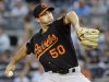 Baltimore Orioles starting pitcher Miguel Gonzalez (50) throws against the New York Yankees in the first inning of a baseball game on Friday, Aug., 31, 2012, at Yankee Stadium in New York. (AP Photo/Kathy Kmonicek)