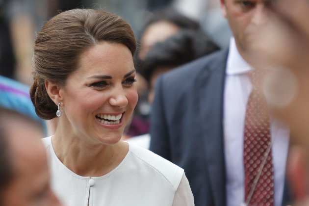 Catherine, Britain's Duchess of Cambridge, smiles at well-wishers at KLCC Park in Kuala Lumpur