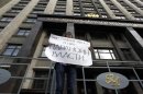 A lone protester demonstrates against the reading of a new law requiring foreign funded non-governmental organisations working in Russia to disclose details of their activities, outside the Duma