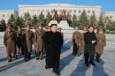 This undated picture released by North Korea's official Korean Central News Agency on January 13, 2015 shows North Korean leader Kim Jong-Un (C) during an inspection of the Air and Anti-Air Force of the Korean People's Army command