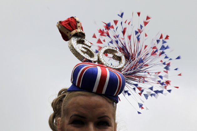 Racegoer Webster poses for photographs on Ladies&#39; Day, the third day of racing at the Royal Ascot, southwest of London