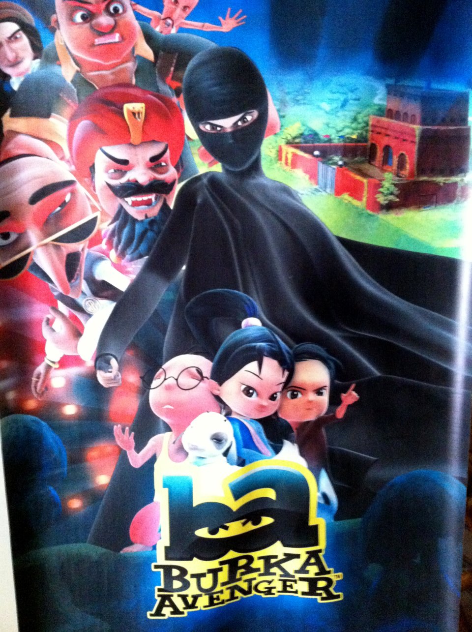 This Thursday, July 11, 2013 photo shows a poster for the "Burka Avenger" cartoon series, which is scheduled to start running on Geo TV in early August. Wonder Woman and Supergirl now have a Pakistani counterpart in the pantheon of female superheroes _ one who shows a lot less skin. Meet Burka Avenger: a mild-mannered teacher with secret martial arts skills who uses a flowing black burka to hide her identity as she fights local thugs seeking to shut down the girls' school where she works. Sadly, it's a battle Pakistanis are all too familiar with in the real world.(AP Photo/Sebastian Abbot)